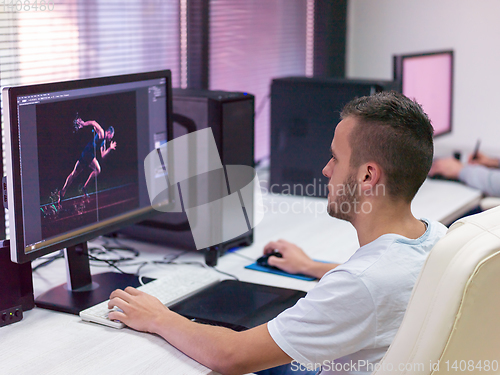 Image of Graphic Designer Working at Workplace