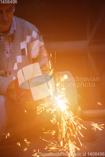 Image of the blacksmith polishing metal products