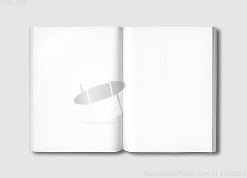 Image of White open book isolated on grey