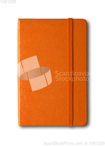 Image of Orange closed notebook isolated on white
