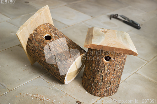 Image of Two birdhouse of alder logs