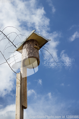 Image of Birdhouse made from whole wood logs