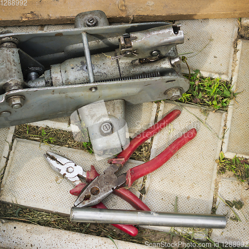 Image of A pair of pliers and old Jack