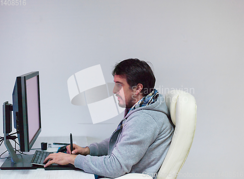 Image of Graphic Designer Working at Workplace