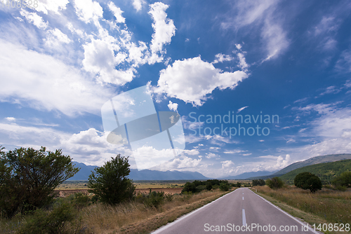 Image of asphalt road in beautiful countryside