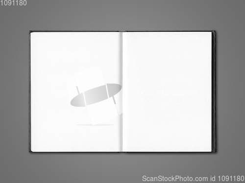 Image of Blank open notebook isolated on dark grey