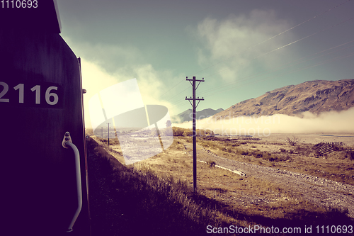 Image of Train in Mountain fields landscape, New Zealand