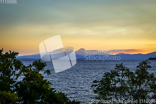 Image of Taupo Lake and Tongariro volcano at sunset, New Zealand