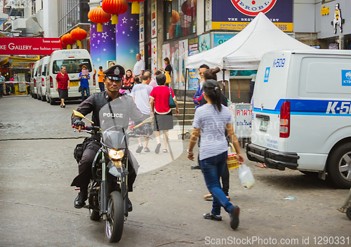 Image of Policeman on a scooter, Thailand