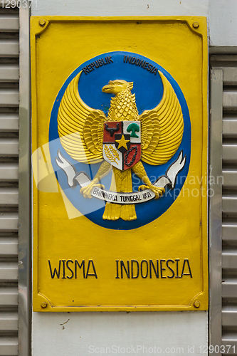 Image of Label with coat of arms of Indonesia on gates of embassy