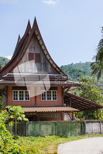 Image of Little Thai houses and palm trees