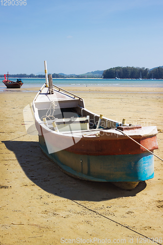 Image of Boat on land in the area of sea tide