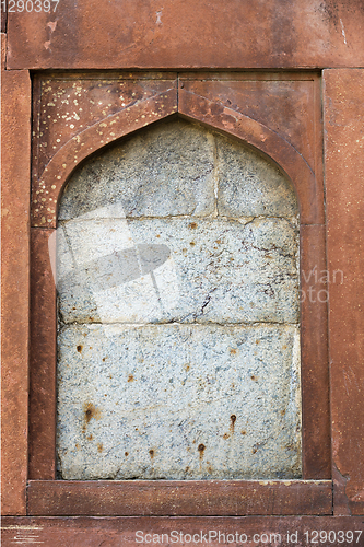 Image of Stone framing window in an ancient Asian architecture