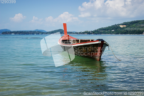 Image of Thai wooden boat on a calm sea