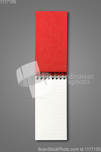 Image of Blank open spiral notebook isolated on dark grey