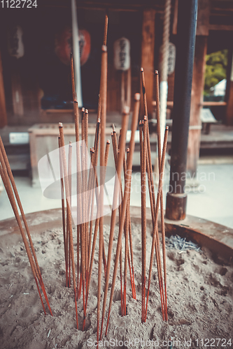 Image of incense sticks in Kinkaku-ji temple, Kyoto, Japan