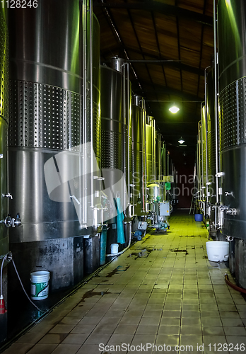 Image of metal wine barrels in a winery