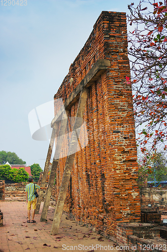 Image of Tourist on ruins of an monastery, Thailand 