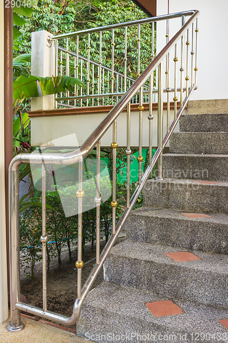 Image of Steel railing on a stone staircase