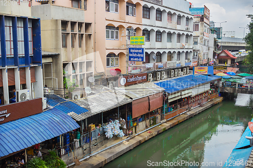 Image of Houses standing above the water channel. Bangkok