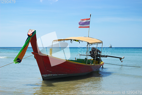 Image of Long-tailed Thai boat near the shore