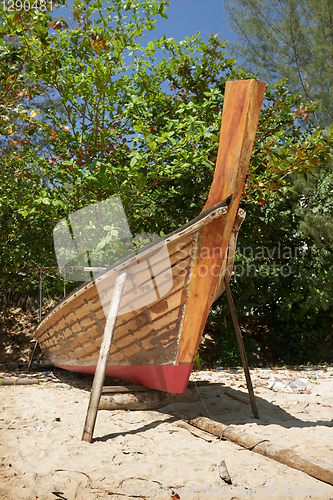 Image of Thai boat is being repaired at beach