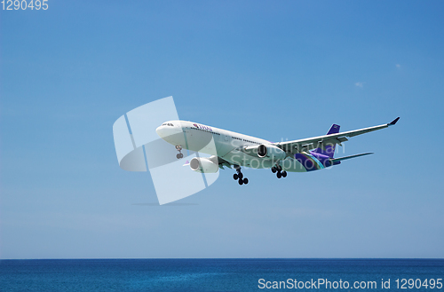 Image of Airbus A330 of Thaiairway. Landing, flies from the ocean