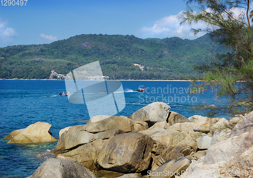 Image of Thai pleasure boating on a calm sea bay