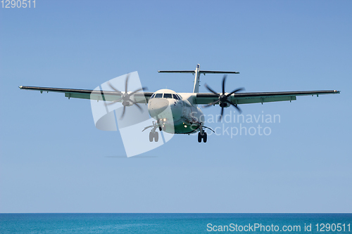 Image of Turboprop aircraft, Landing in Phuket International Airport in Thailand, flies from the ocean