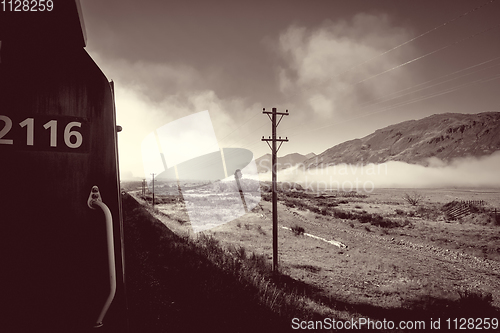 Image of Train in Mountain fields landscape, New Zealand