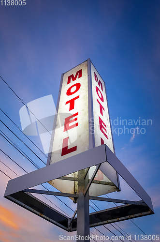Image of Vintage motel sign at sunset 