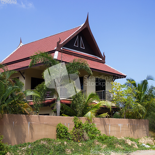 Image of Little Thai houses and palm trees