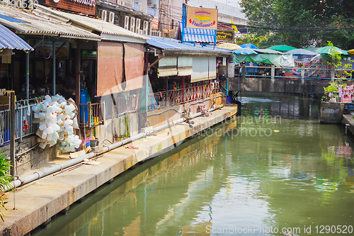 Image of Houses standing above the water channel. Bangkok