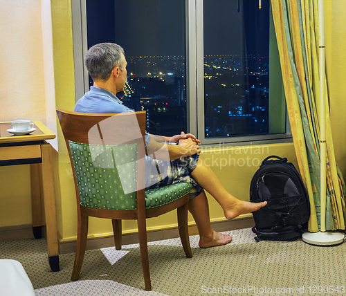 Image of Tourist looks of the rooms at night Bangkok