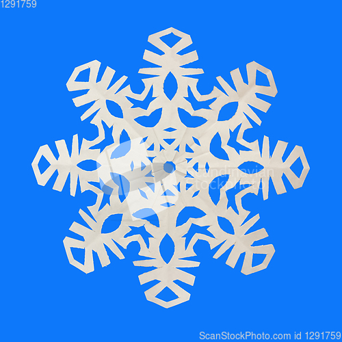 Image of Snowflake cut out of paper on a blue background