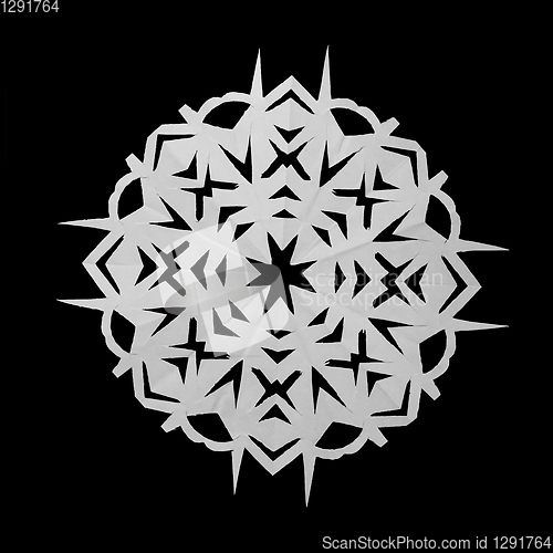 Image of Paper white snowflake lie on black background