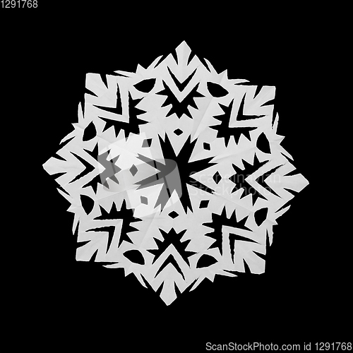 Image of White snowflake cut out of paper on black background