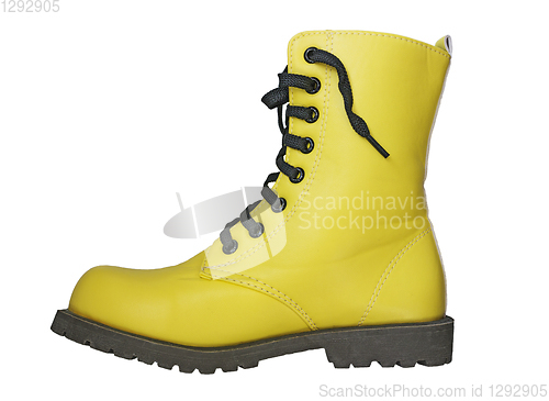 Image of Yellow boot with black lacing on white background