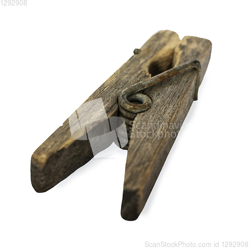 Image of Ramshackle wooden clothespin on white