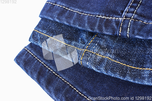 Image of Various seams blue denim trousers on white background