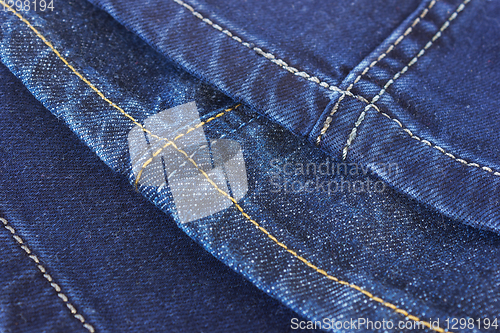 Image of Seams blue denim trousers on white background