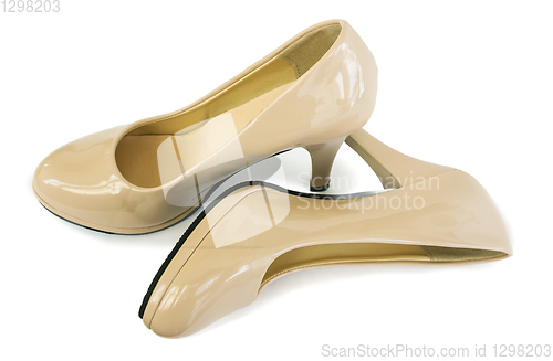 Image of Elegant women\'s shoes beige color white background