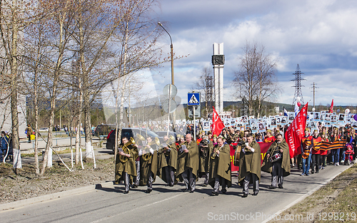 Image of Immortal Regiment marches at entrance city. Polyarnye Zori. Russia