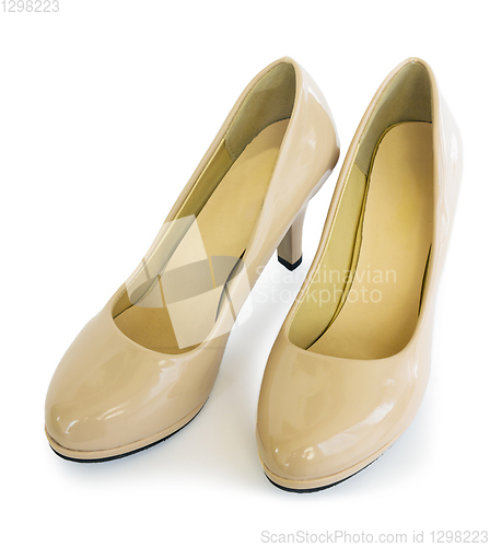 Image of Pair female shoes beige color white background