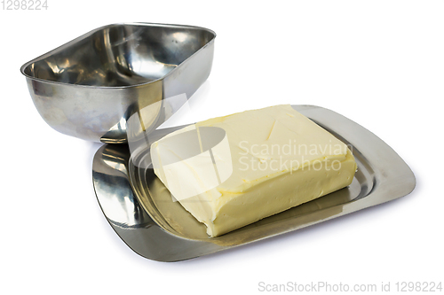 Image of Pack of yellowish butter in flatware  for butter