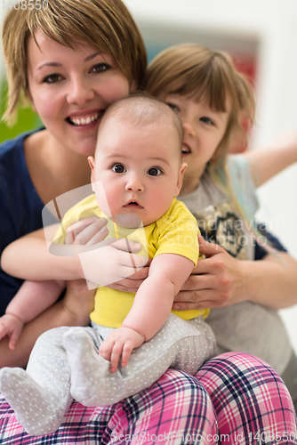 Image of portrait of young mother with  her kids