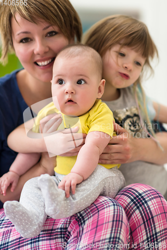 Image of portrait of young mother with  her kids