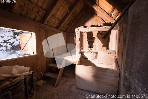 Image of interior of retro wooden watermill