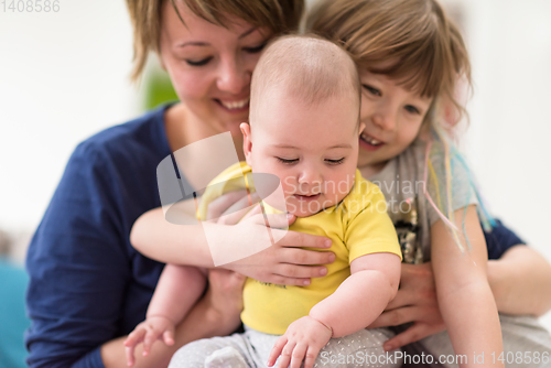 Image of portrait of young mother with  her kids