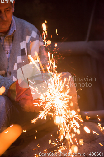 Image of the blacksmith polishing metal products